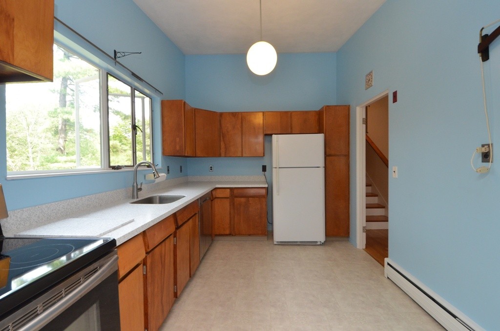 39 Peacock Farm Road Lexington, MA 02421 - Photo 7 of 30 a kitchen with a refrigerator and a sink