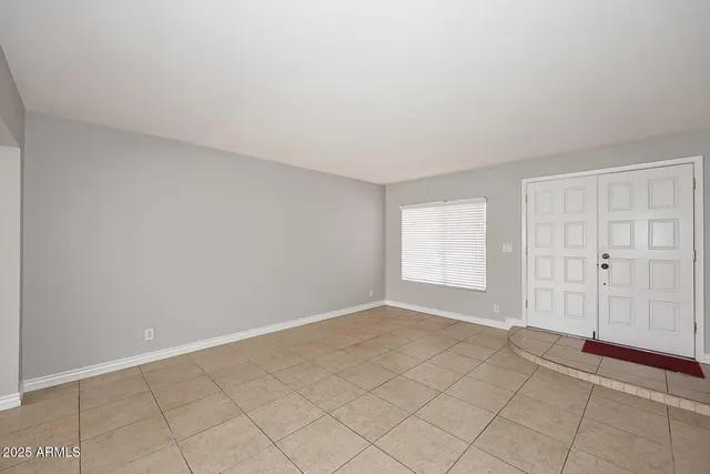 a view of an empty room with window