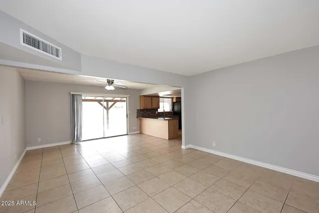 a view of a kitchen with a sink and a window