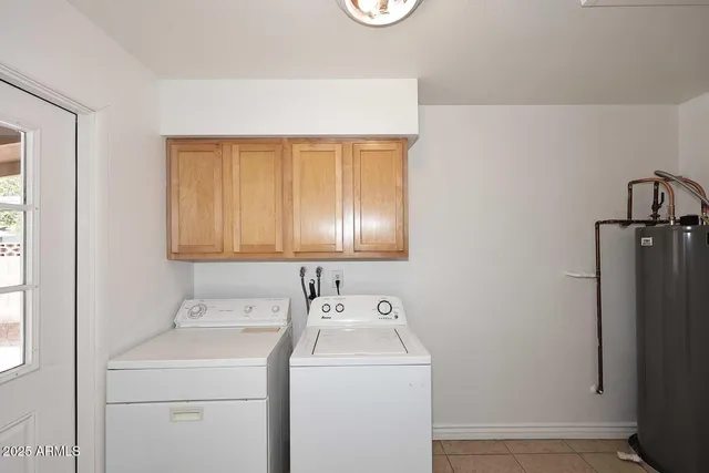 a view of storage and utility room with washer and dryer