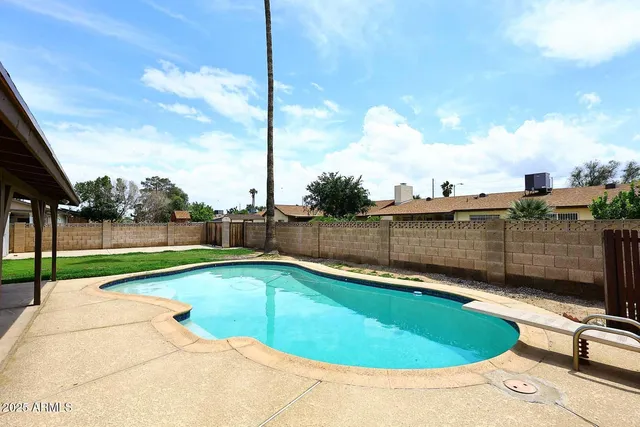 a view of a swimming pool with a terrace