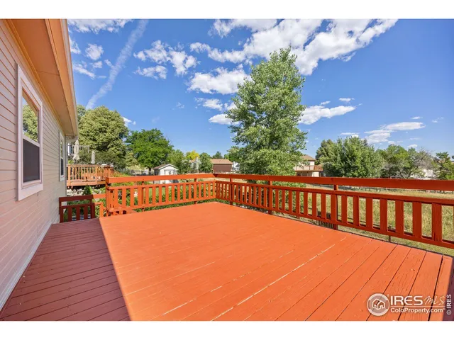 a view of deck with wooden floor and a potted plant