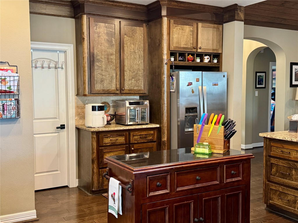 200 Harbor Run Drive Coldspring, TX 77331 - Photo 16 of 50 a kitchen with stainless steel appliances a stove and a refrigerator