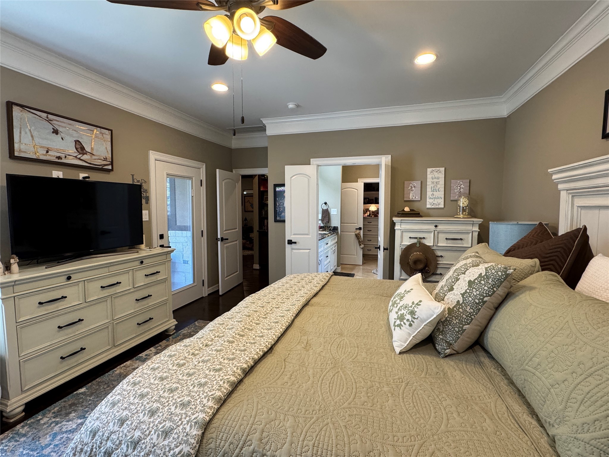200 Harbor Run Drive Coldspring, TX 77331 - Photo 50 of 50 The primary bedroom encompasses the whole end of this house. Take a look at the floor plan to get a visual. This room walks into the bathroom and then and then there is a walk-in closet to die for.You can access the back porch through the door to the left.
