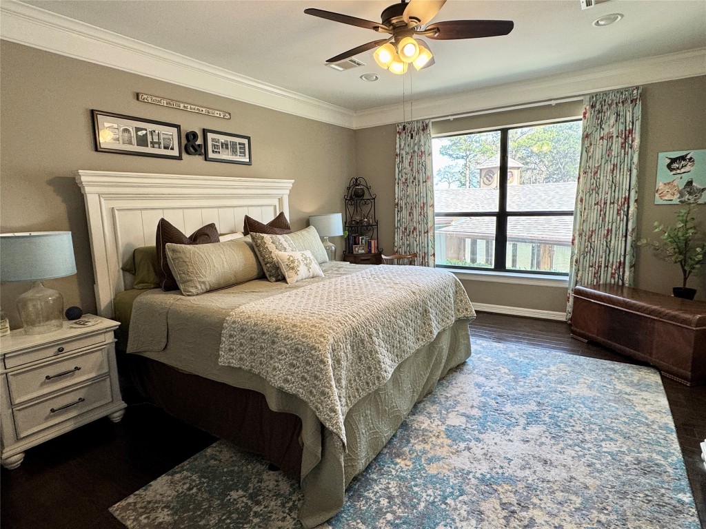 200 Harbor Run Drive Coldspring, TX 77331 - Photo 25 of 50 a bedroom with a large bed and a tv