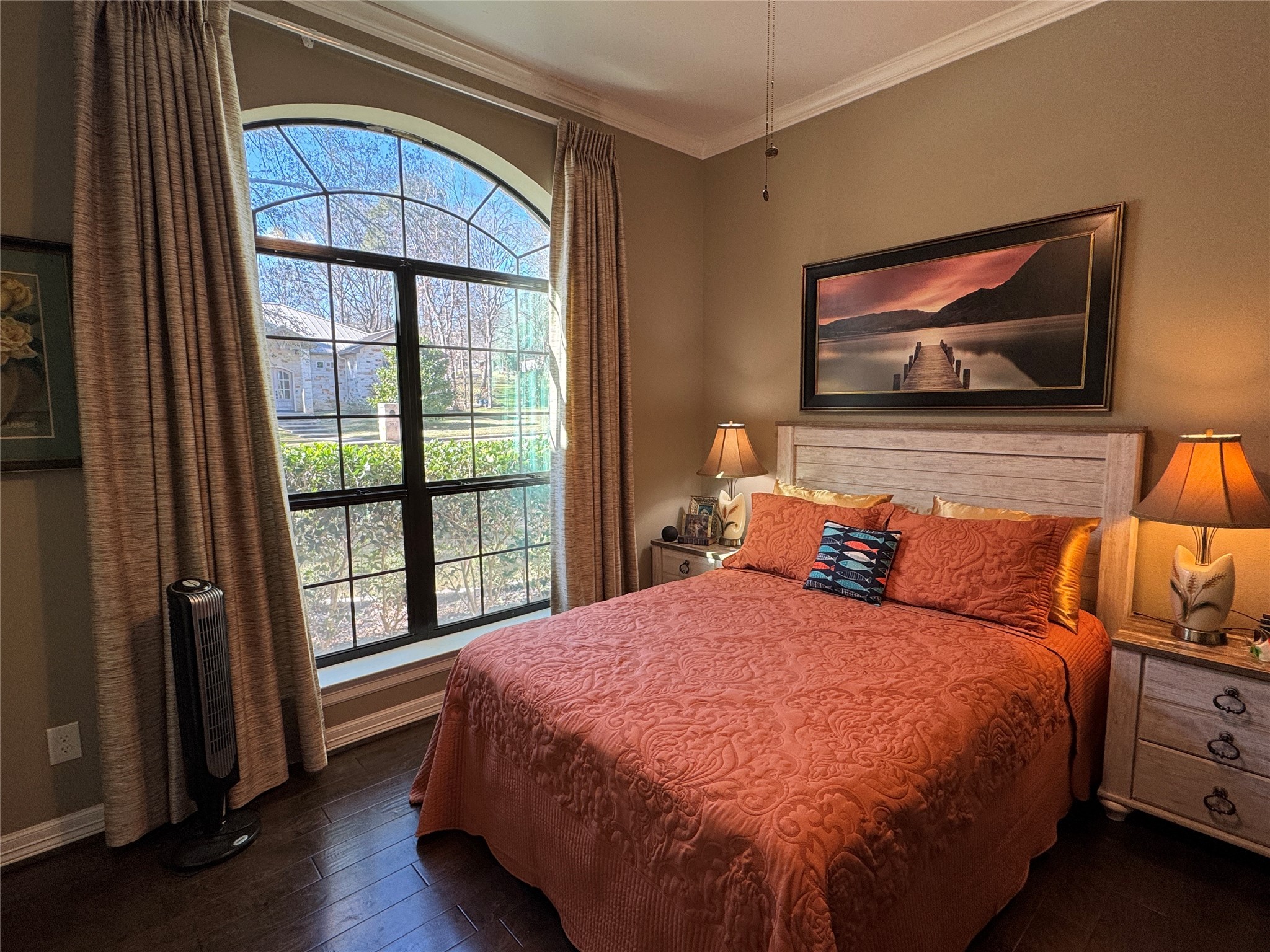 200 Harbor Run Drive Coldspring, TX 77331 - Photo 31 of 50 This cozy bedroom features a large arched window that provides wonderful light. Hardwood floors, neutral walls, and direct access to the guest bath make this room a favorite!