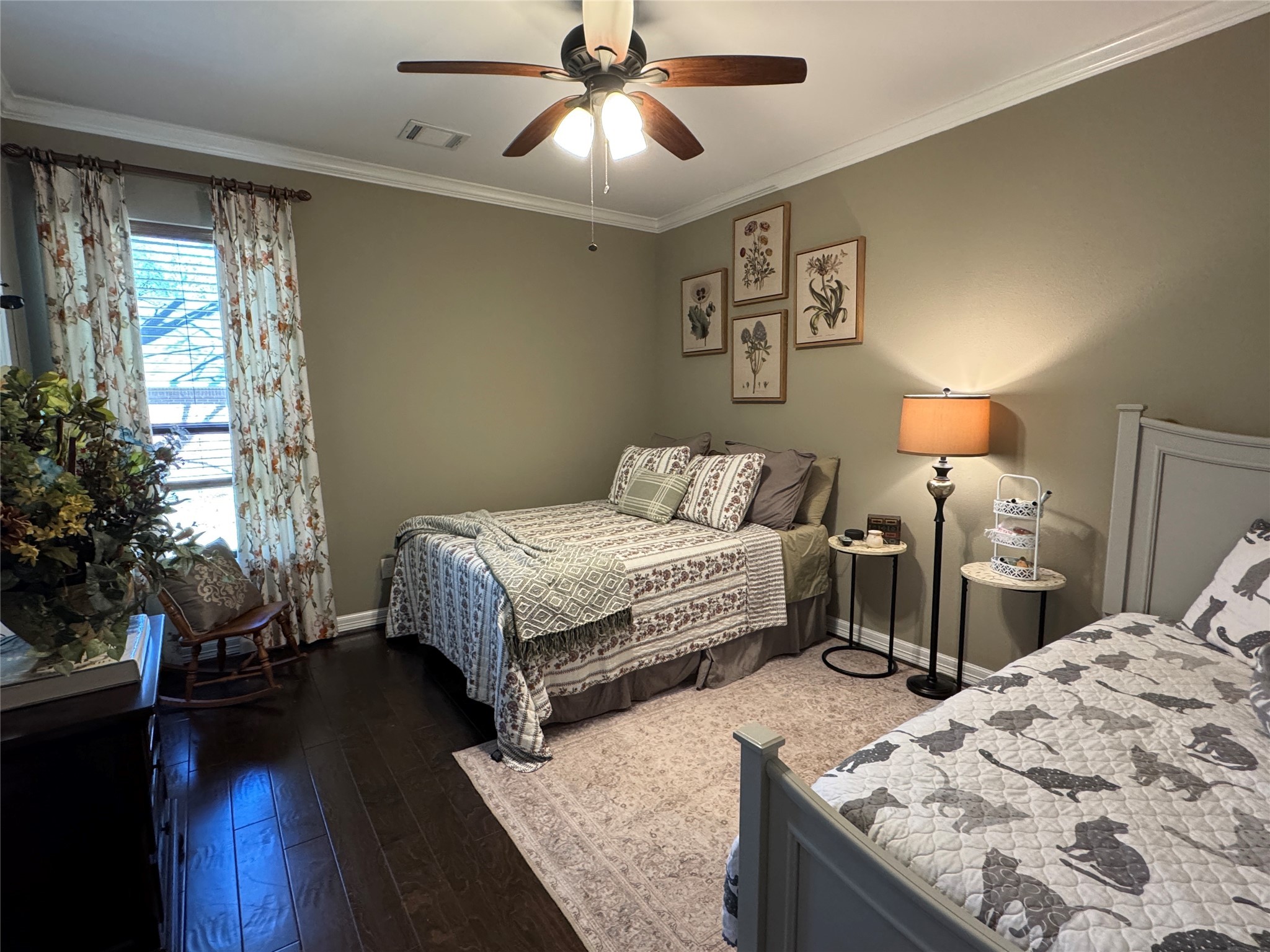 200 Harbor Run Drive Coldspring, TX 77331 - Photo 36 of 50 This bedroom is large enough to accommodate a queen bed and a single trundle bed that opes to a king (You have to move the nightstands and floor lamp, but you can do it if you need to.) It is accented with floral curtains, engineered wood floor, a ceiling fan. It has a lovely walk in closet and natural light brightens the space.