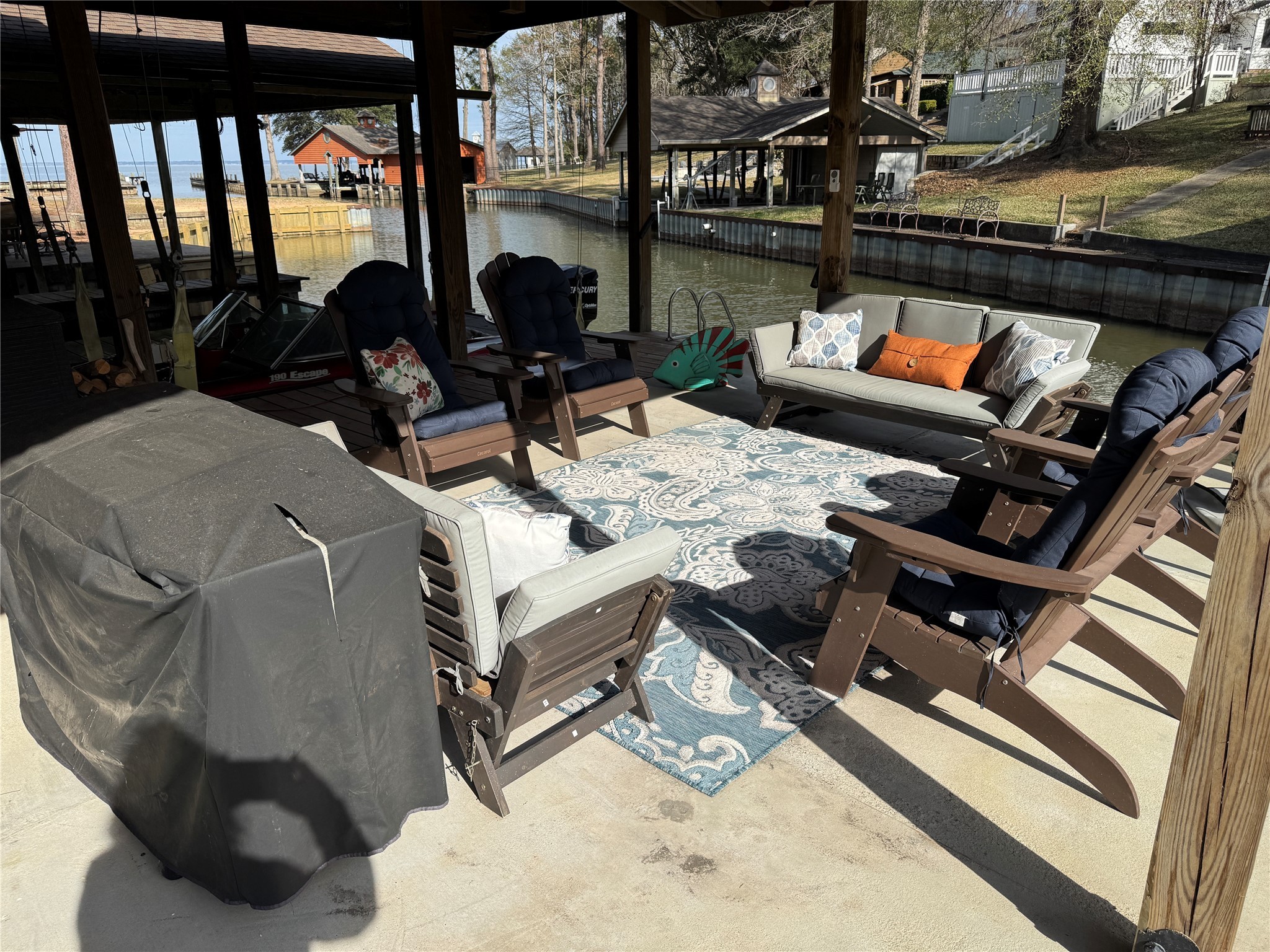 200 Harbor Run Drive Coldspring, TX 77331 - Photo 43 of 50 Gather at the water for dinner, the ball game, swim, or just hang out! You will absolutely LOVE this favourite feature of the property.