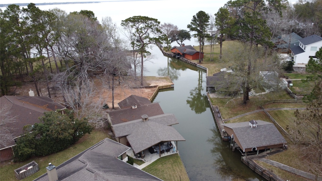 200 Harbor Run Drive Coldspring, TX 77331 - Photo 45 of 50 an aerial view of a house with a yard and lake view