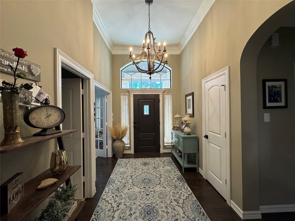 200 Harbor Run Drive Coldspring, TX 77331 - Photo 5 of 50 a hallway with chandelier and wooden floor