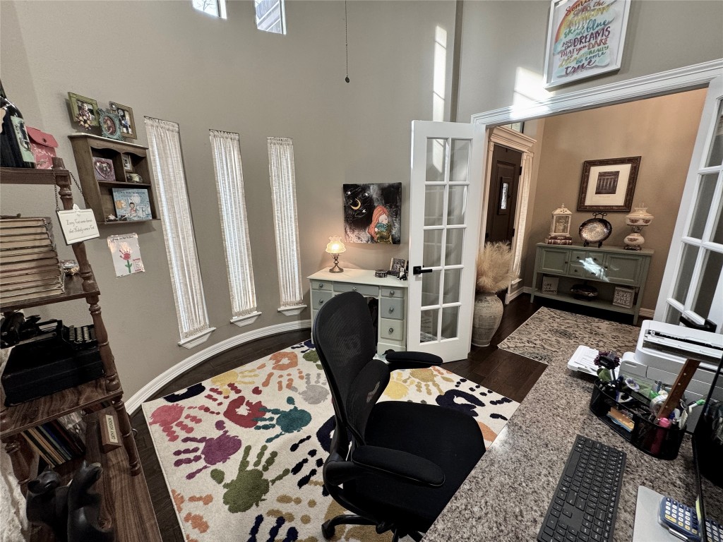 200 Harbor Run Drive Coldspring, TX 77331 - Photo 8 of 50 This inviting home office features high ceilings and ample natural light from tall windows. It is Ideal for a productive and inspiring work environment. If a home office is not a necessity for you, it would also make a fabulous music room, library, play room, or extra guest room. The possibilities are endless.