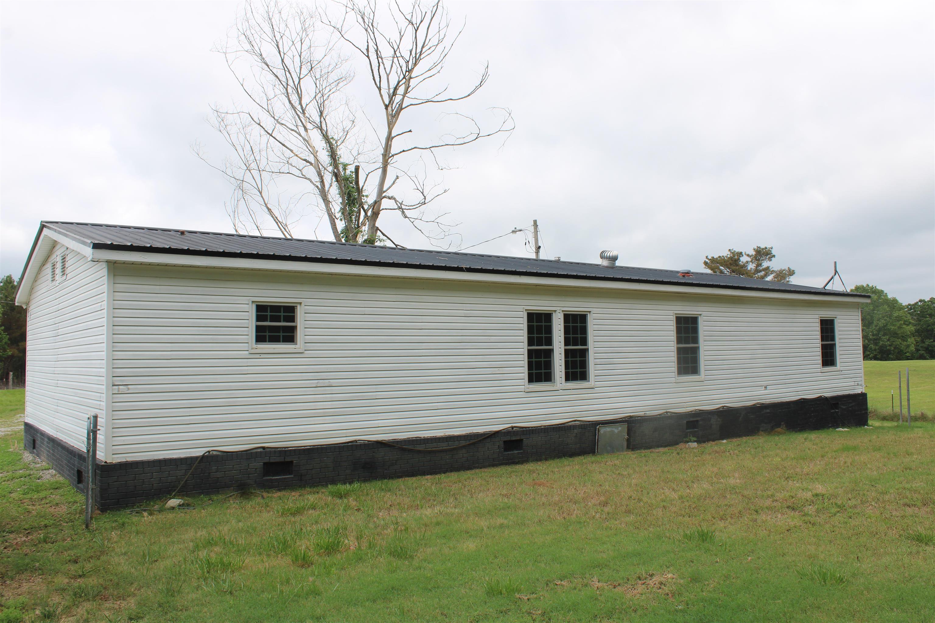 1660 Candy Owens Road Moscow, TN 38057 - Photo 1 of 14 a view of a house with a backyard