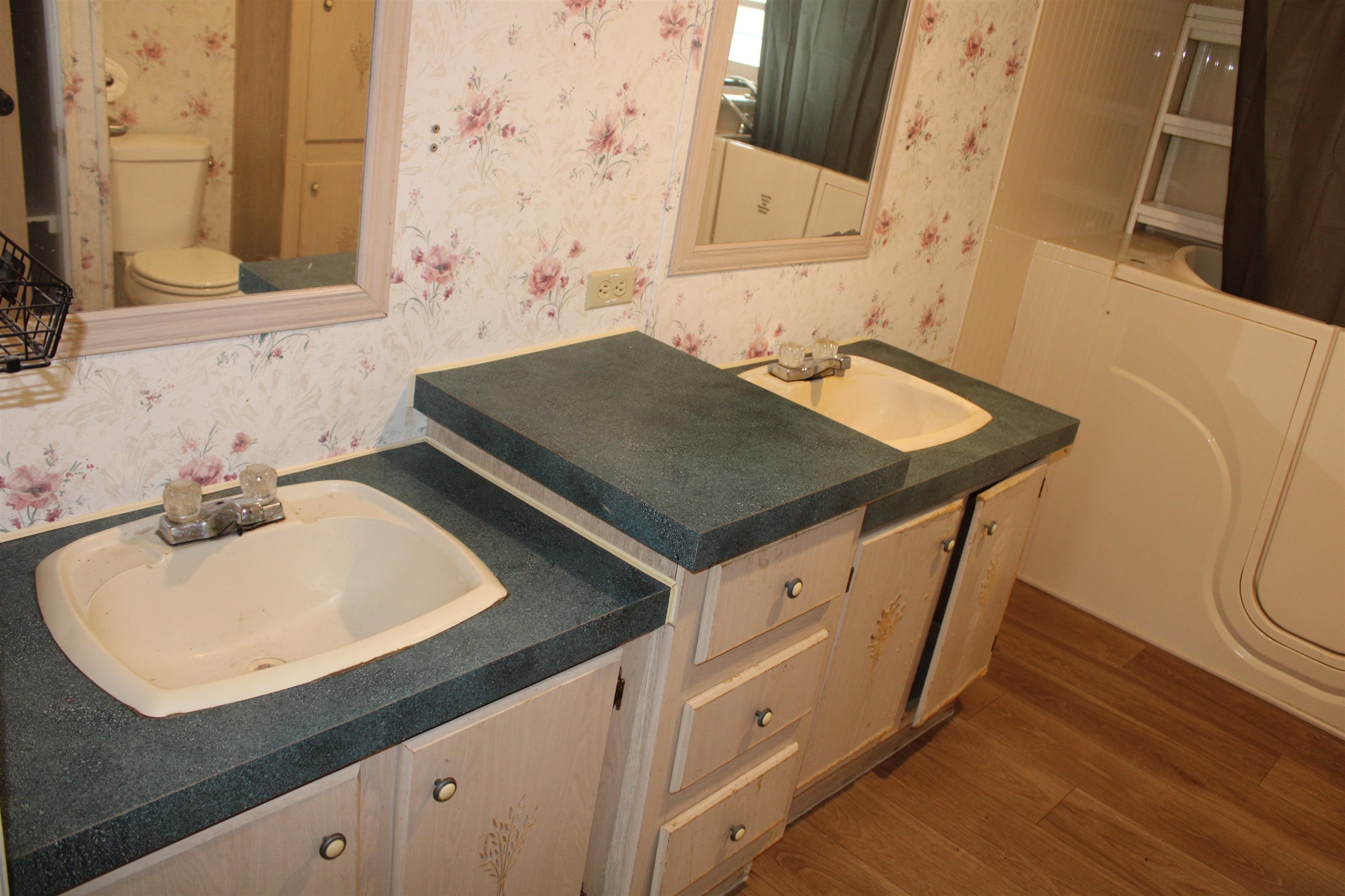 1660 Candy Owens Road Moscow, TN 38057 - Photo 7 of 14 a bathroom with a sink and a mirror