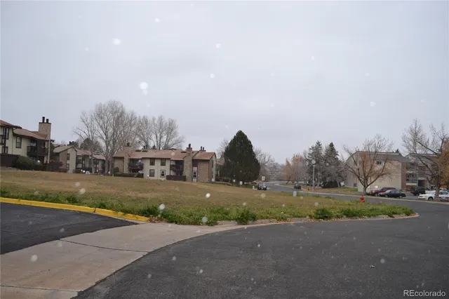 a view of a street with houses on both side