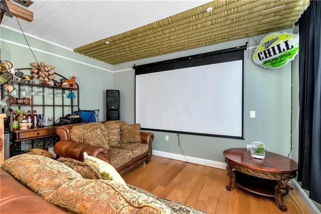 a living room with furniture a piano and a window