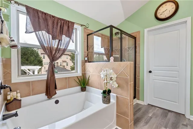 a bedroom with a bed and a mirror