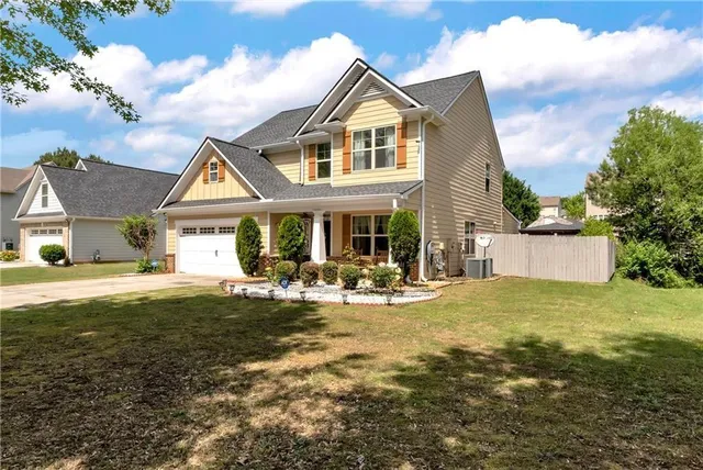 a view of a house with swimming pool and porch