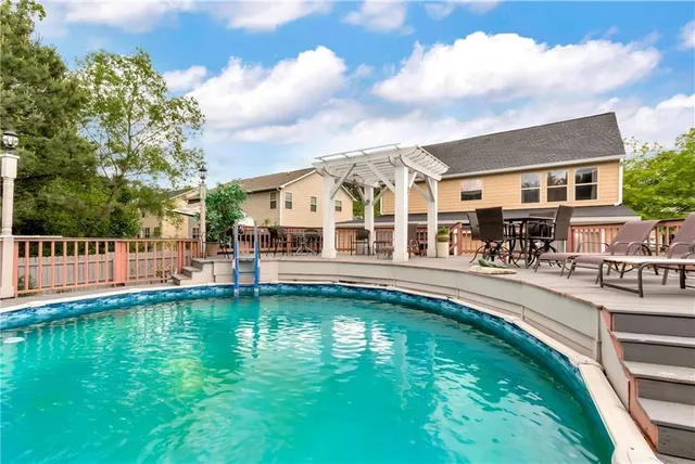 a view of a house with wooden fence