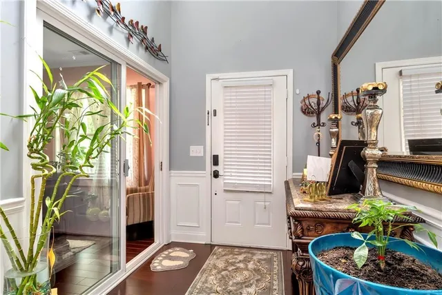 a view of a entryway with furniture and floor to ceiling window