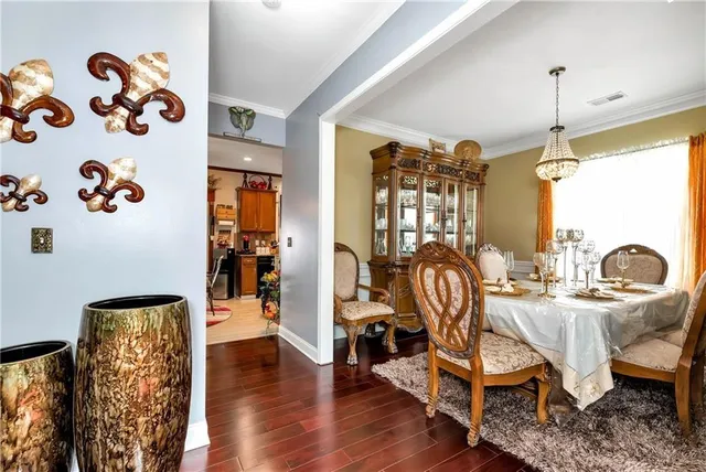 a view of a livingroom with furniture window and wooden floor