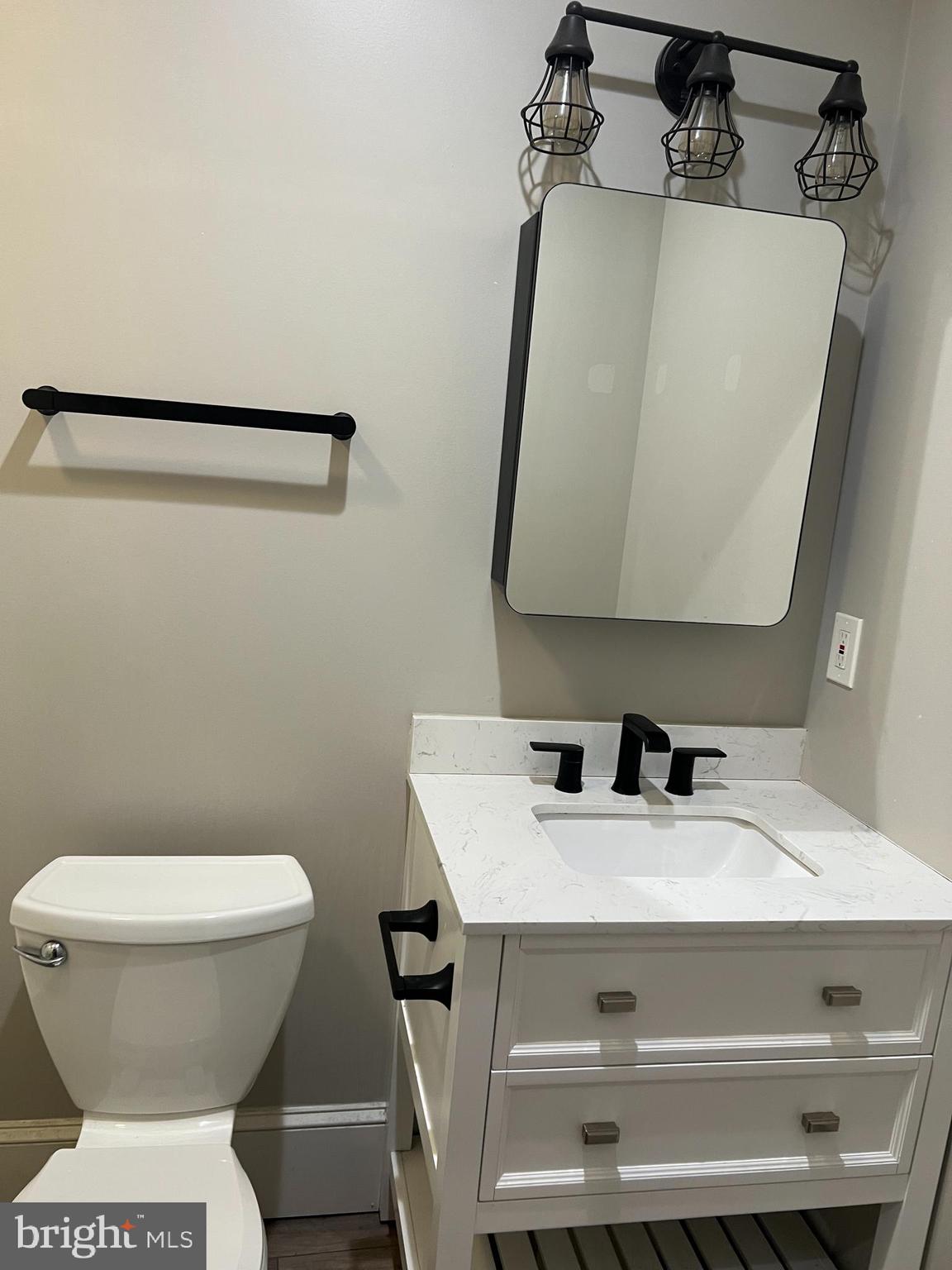 18 West Liberty Street Lancaster, PA 17603 - Photo 20 of 21 a bathroom with a sink and mirror
