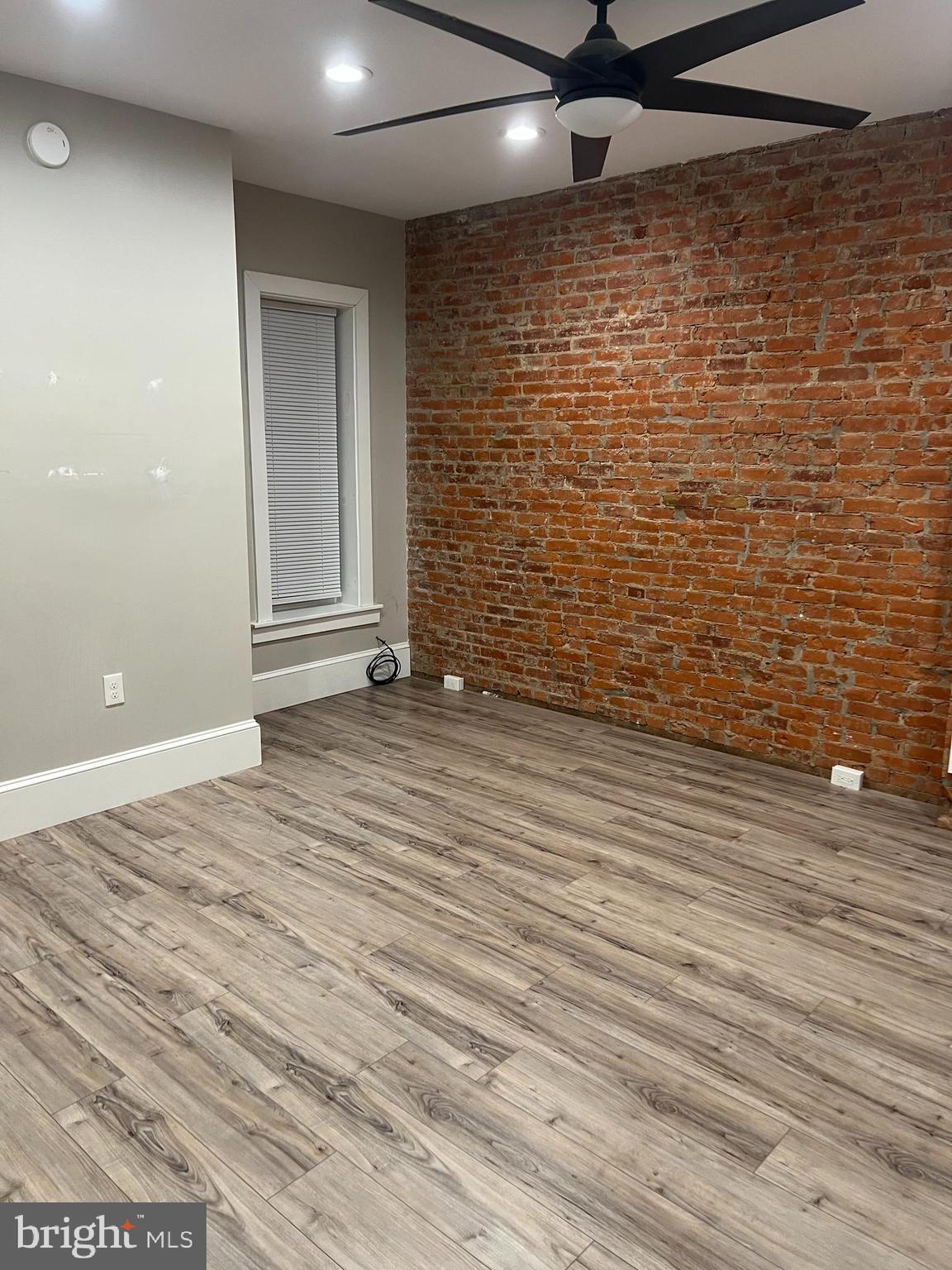 18 West Liberty Street Lancaster, PA 17603 - Photo 7 of 21 a view of an empty room with wooden floor