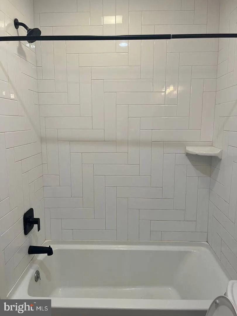 18 West Liberty Street Lancaster, PA 17603 - Photo 9 of 21 a bathroom with a shower and a bathtub