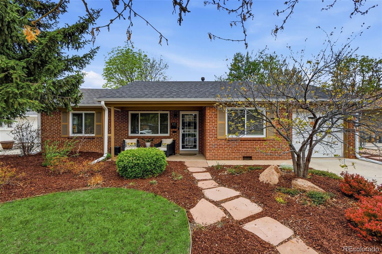 a front view of a house with garden