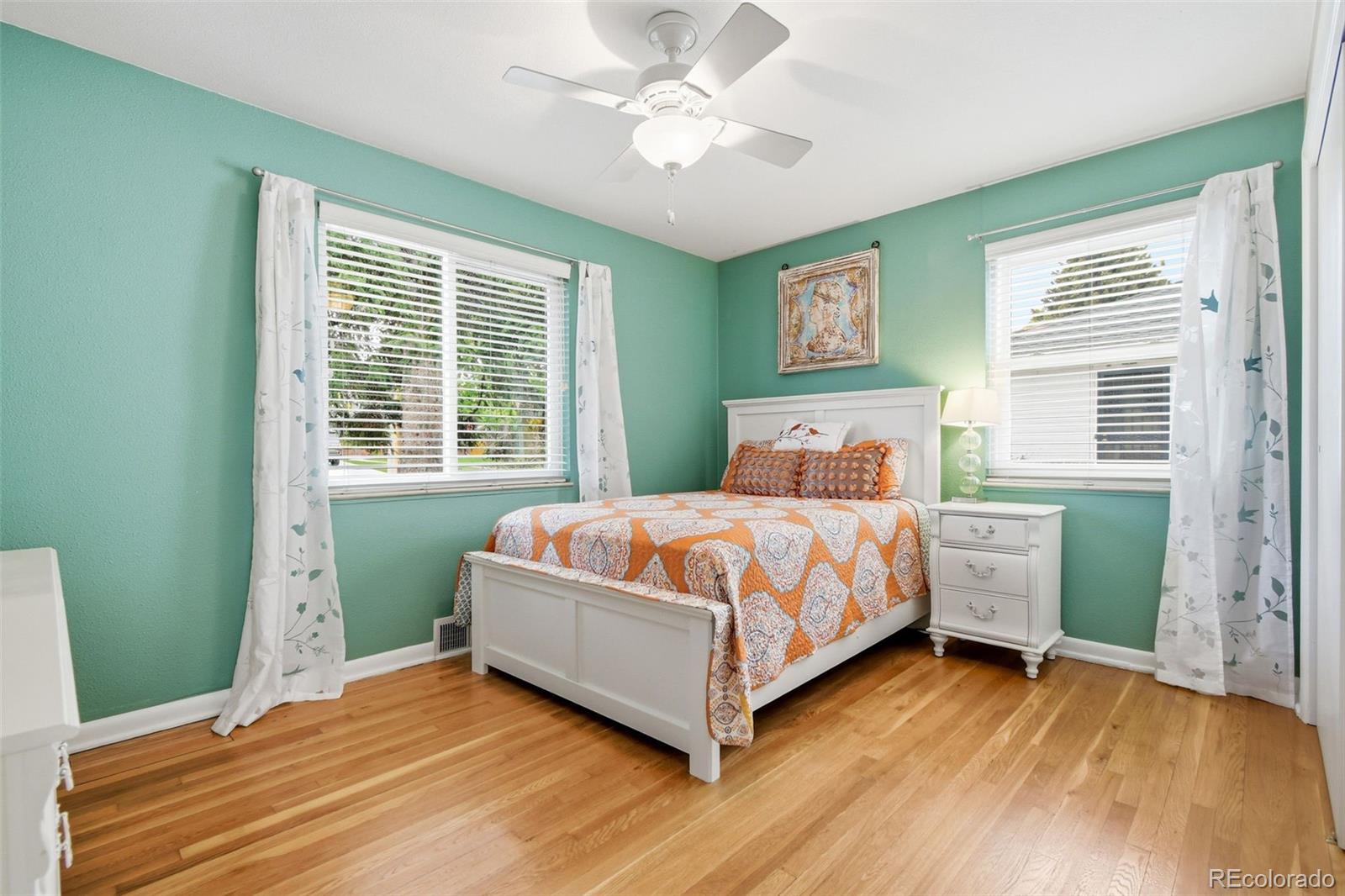 221 Oneida Street Denver, CO 80220 - Photo 13 of 24 a bedroom with a large bed and a window