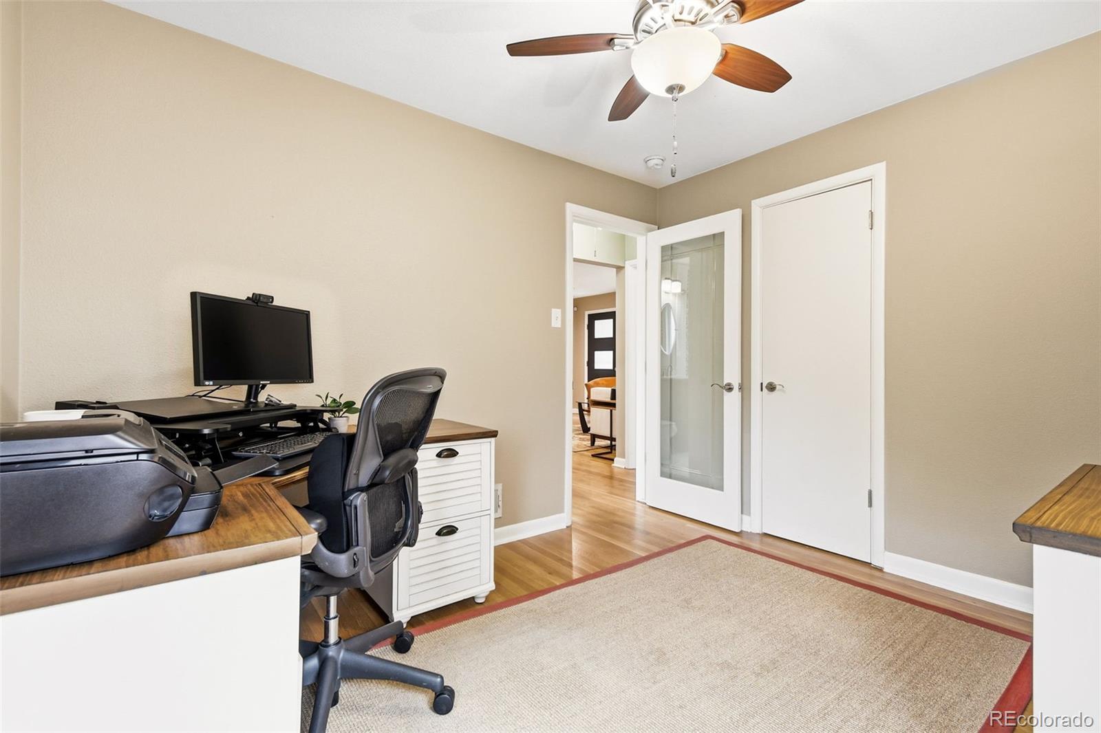 221 Oneida Street Denver, CO 80220 - Photo 16 of 24 a view of a workspace with furniture and a window