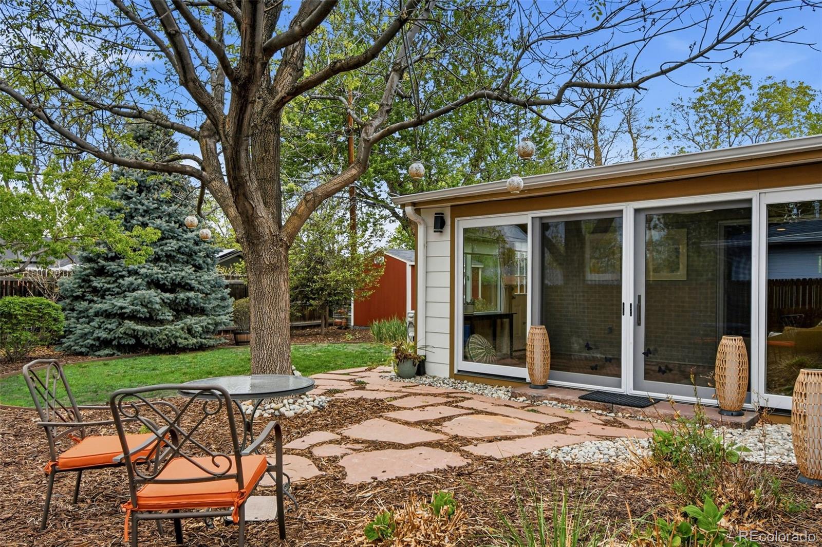 221 Oneida Street Denver, CO 80220 - Photo 23 of 24 a view of a chair and tables in the garden