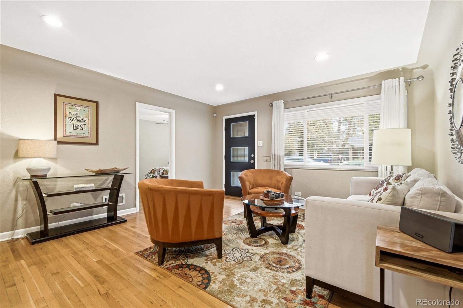 221 Oneida Street Denver, CO 80220 - Photo 4 of 24 a living room with furniture and a window