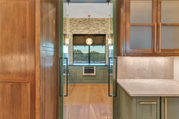 a bathroom with a granite countertop window and a shower