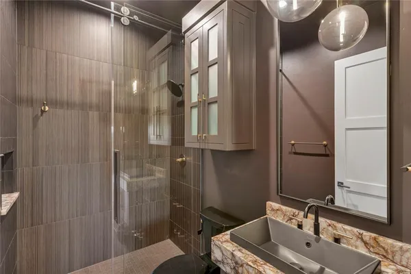 a bathroom with a sink and mirror