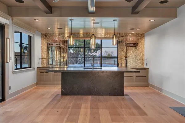 a view of kitchen and windows