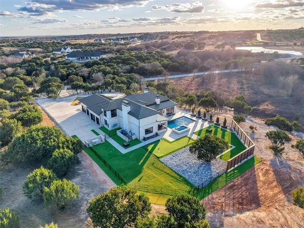 an aerial view of a house with a garden