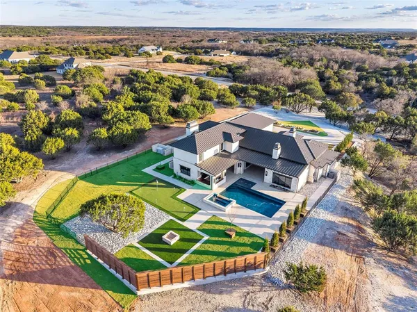 an aerial view of a house with a outdoor space