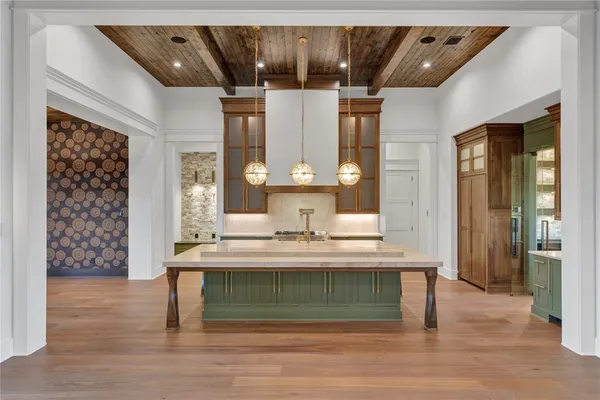 a view of living room with granite countertop furniture and wooden floor