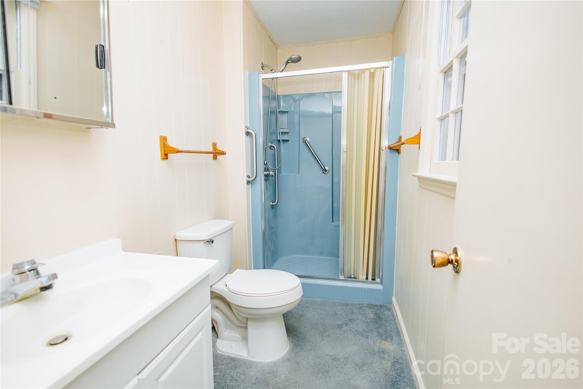 205 Bond Street Marion, NC 28752 - Photo 11 of 37 a bathroom with a sink toilet and shower