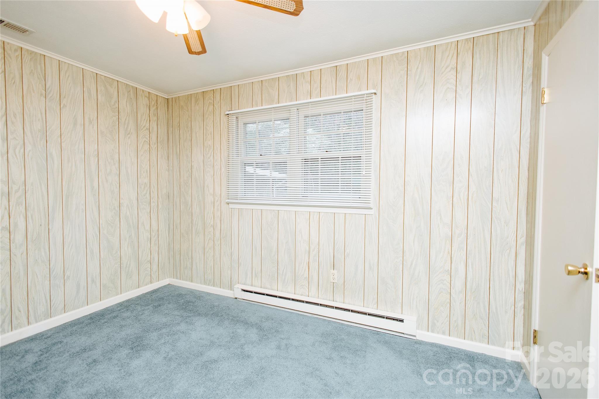 205 Bond Street Marion, NC 28752 - Photo 17 of 37 a view of an empty room with a window