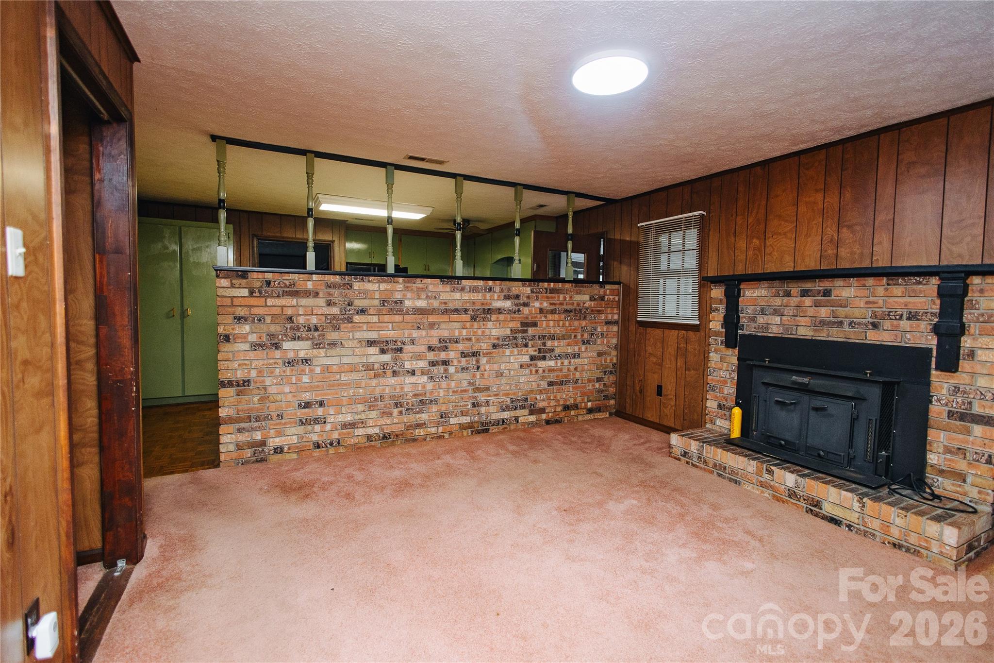 205 Bond Street Marion, NC 28752 - Photo 19 of 37 a view of empty room with a fireplace
