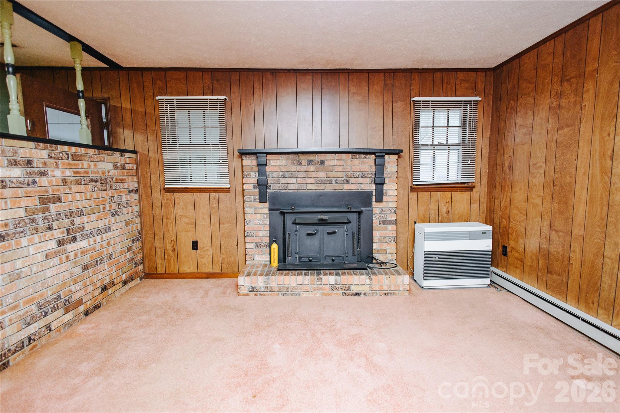 205 Bond Street Marion, NC 28752 - Photo 20 of 37 a living room with a fireplace