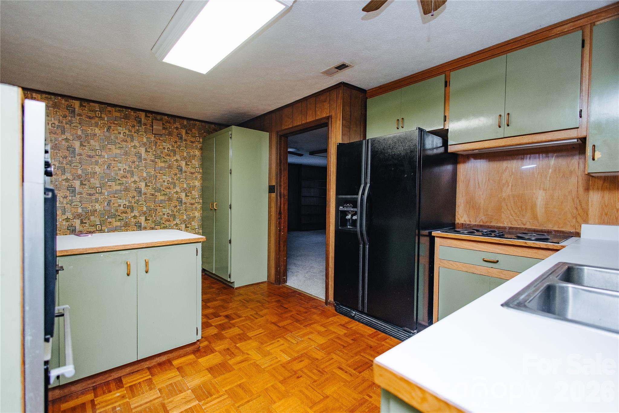 205 Bond Street Marion, NC 28752 - Photo 26 of 37 a kitchen with stainless steel appliances granite countertop a refrigerator and a stove
