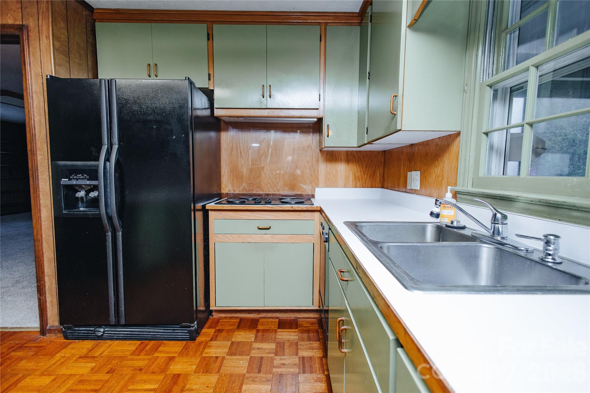 205 Bond Street Marion, NC 28752 - Photo 27 of 37 a kitchen with stainless steel appliances granite countertop a refrigerator and a sink