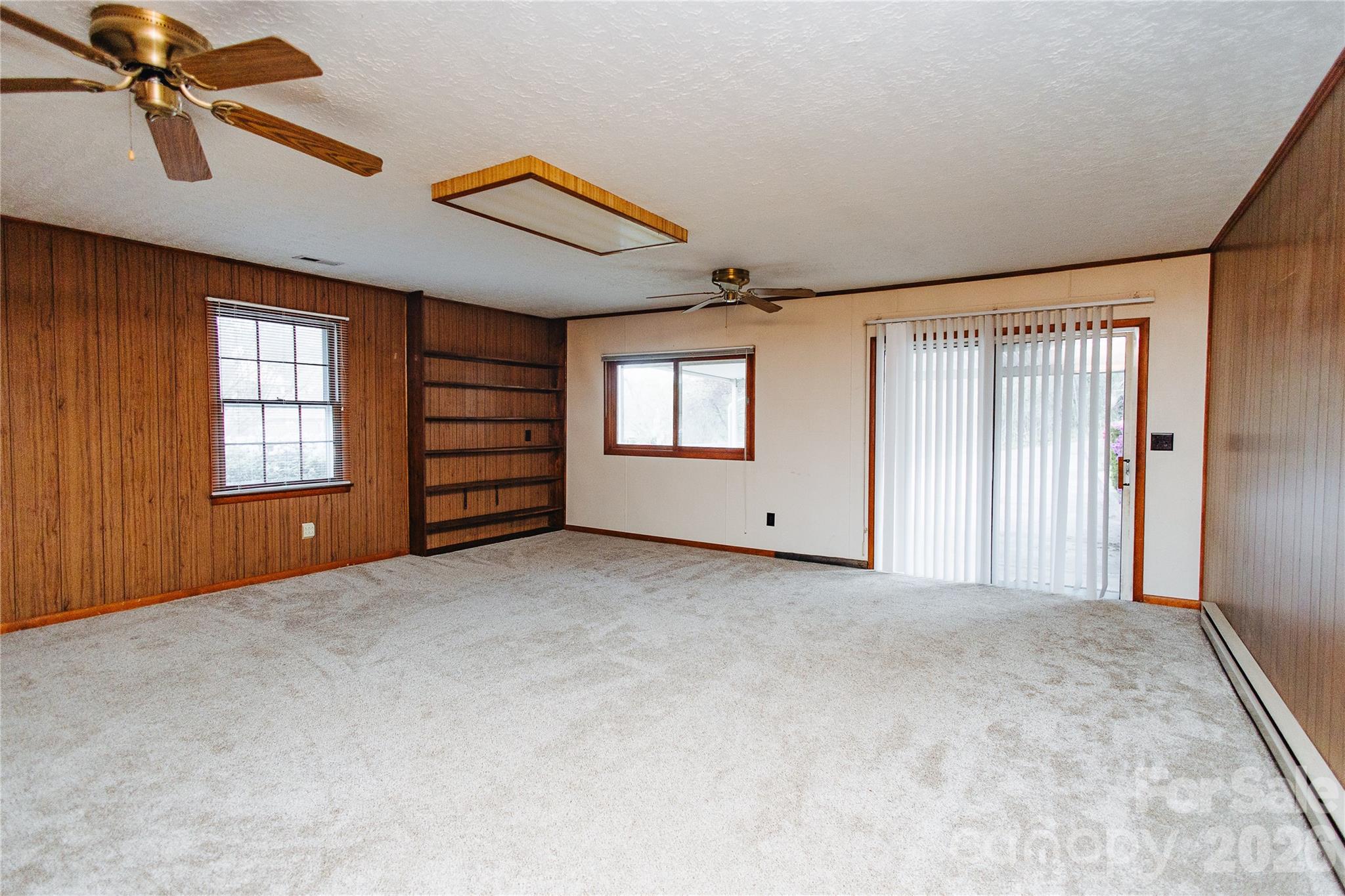 205 Bond Street Marion, NC 28752 - Photo 28 of 37 an empty room with windows and cabinet