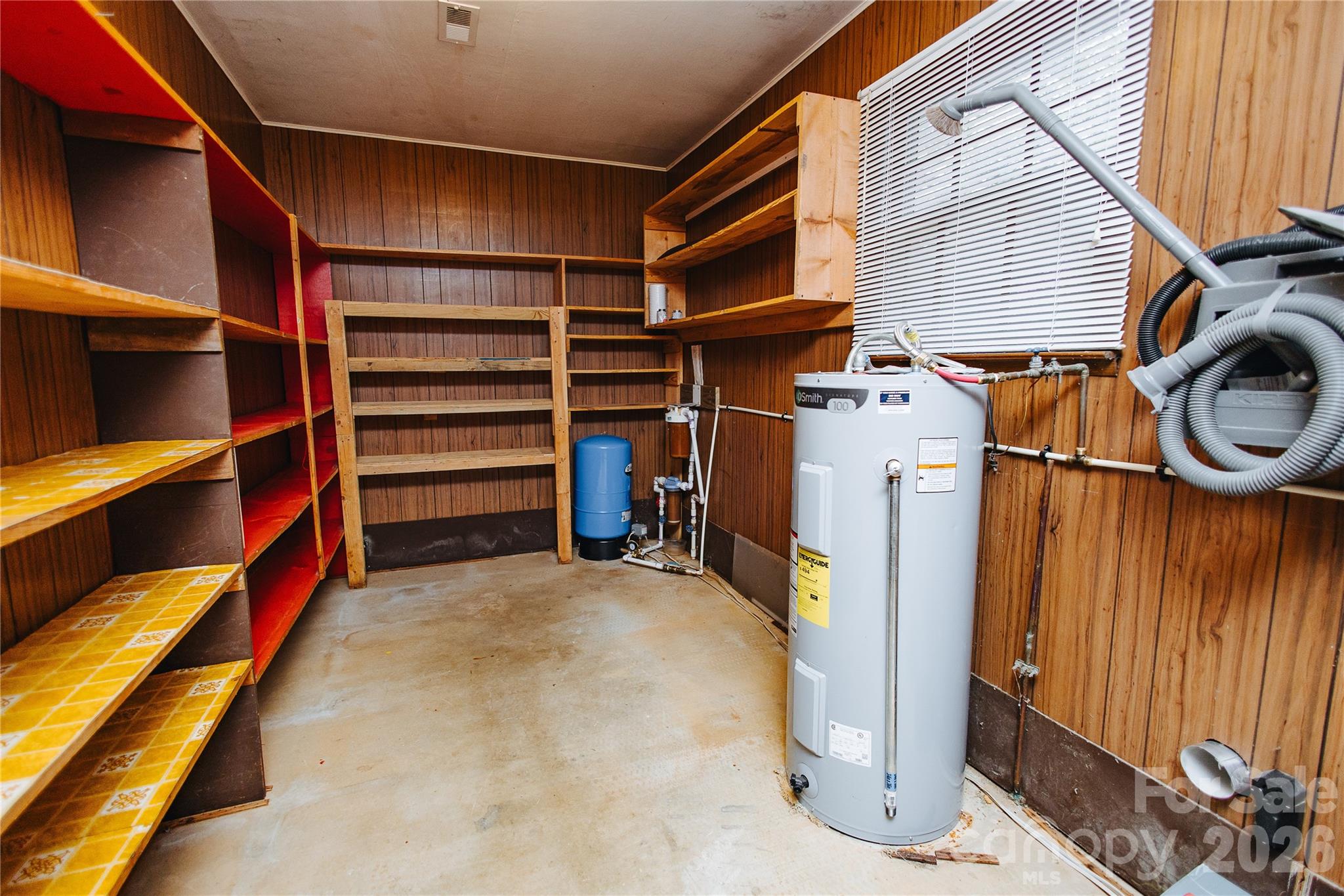 205 Bond Street Marion, NC 28752 - Photo 31 of 37 a view of walk in closet with clothes and shoes