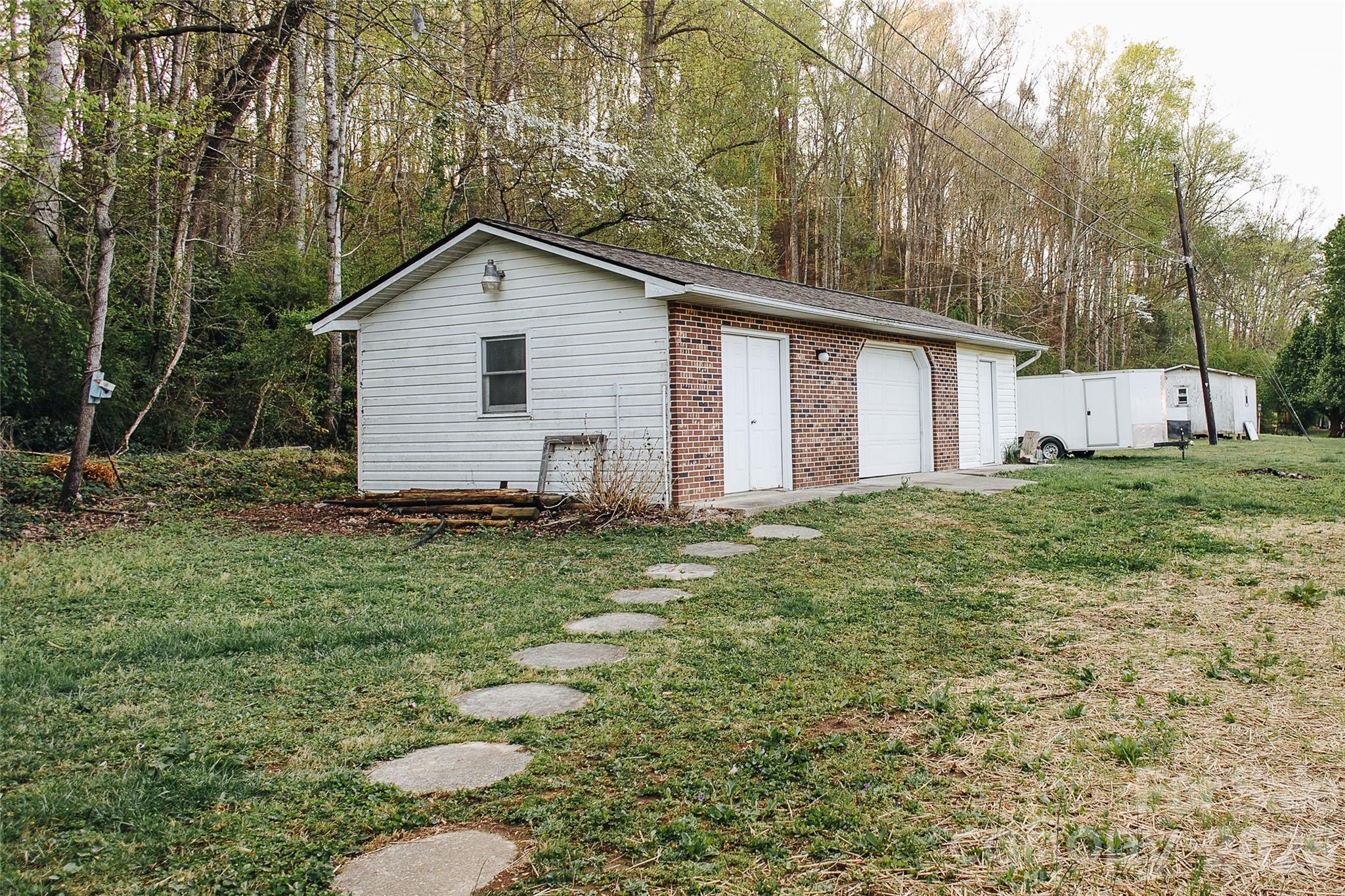 205 Bond Street Marion, NC 28752 - Photo 4 of 37 a view of a house with a yard