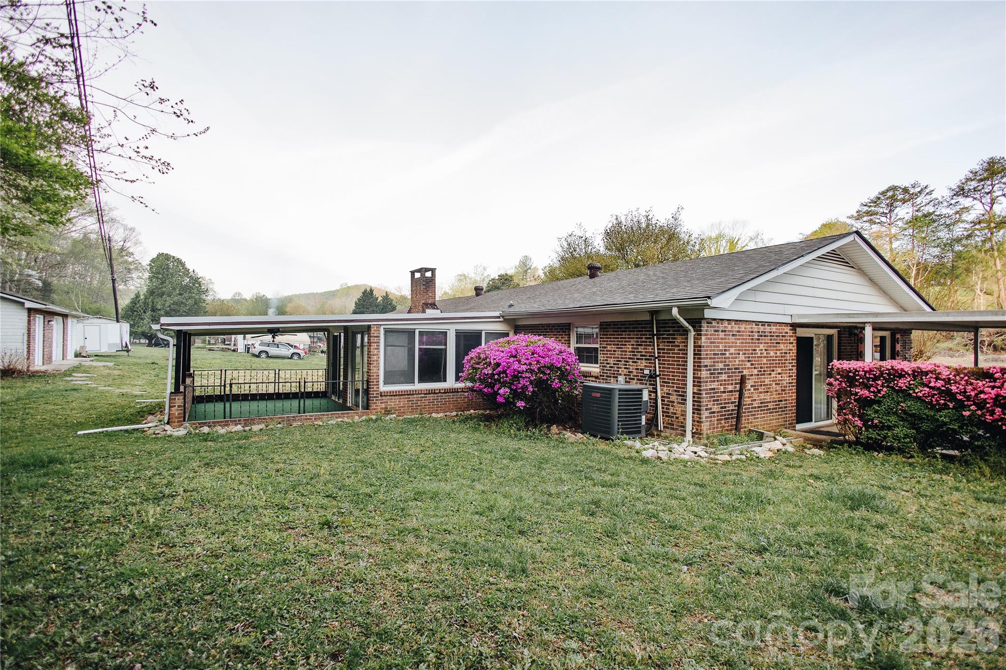 205 Bond Street Marion, NC 28752 - Photo 5 of 37 a view of a house with a yard and sitting area