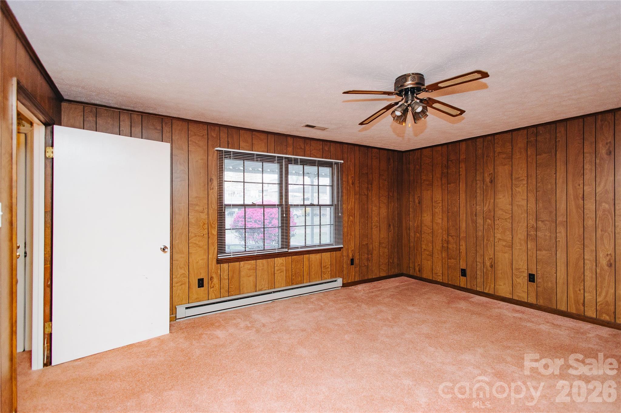 205 Bond Street Marion, NC 28752 - Photo 9 of 37 a view of empty room with windows