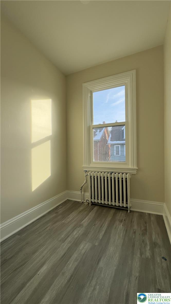 612 East 5th Street Bethlehem, PA 18015 - Photo 19 of 31 an empty room with wooden floor and windows